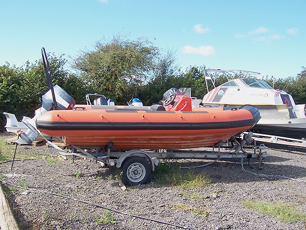 avon-searider-dive-boat-retube Avon Searider Retube in Orange with rubbing strakes, lifline holders, abrasion patches and black bow
